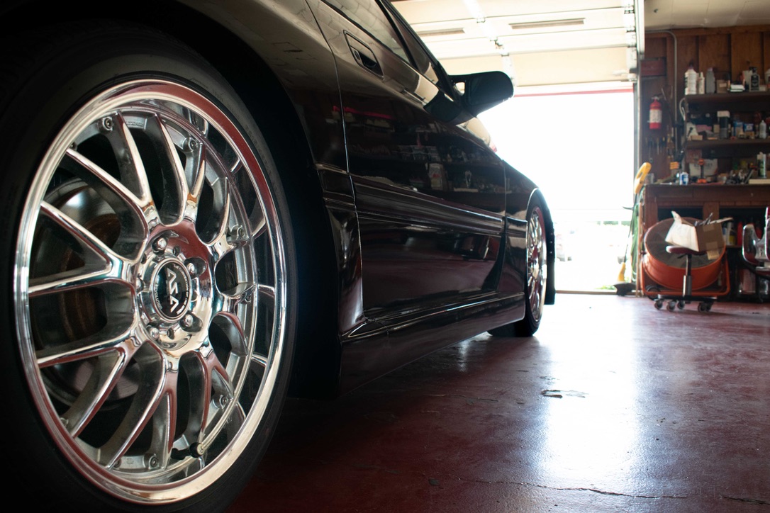 Mazda RX-7 wheel and side profile in the Motion Imports shop